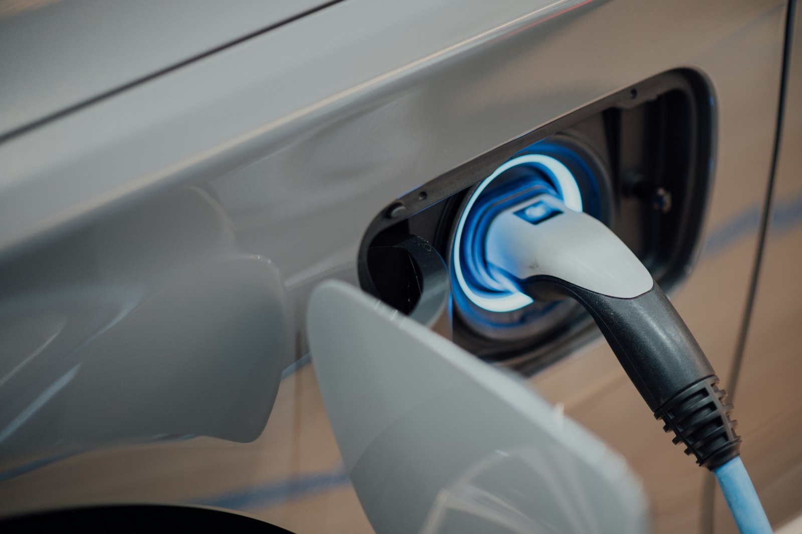 EV charging port with blue glow
