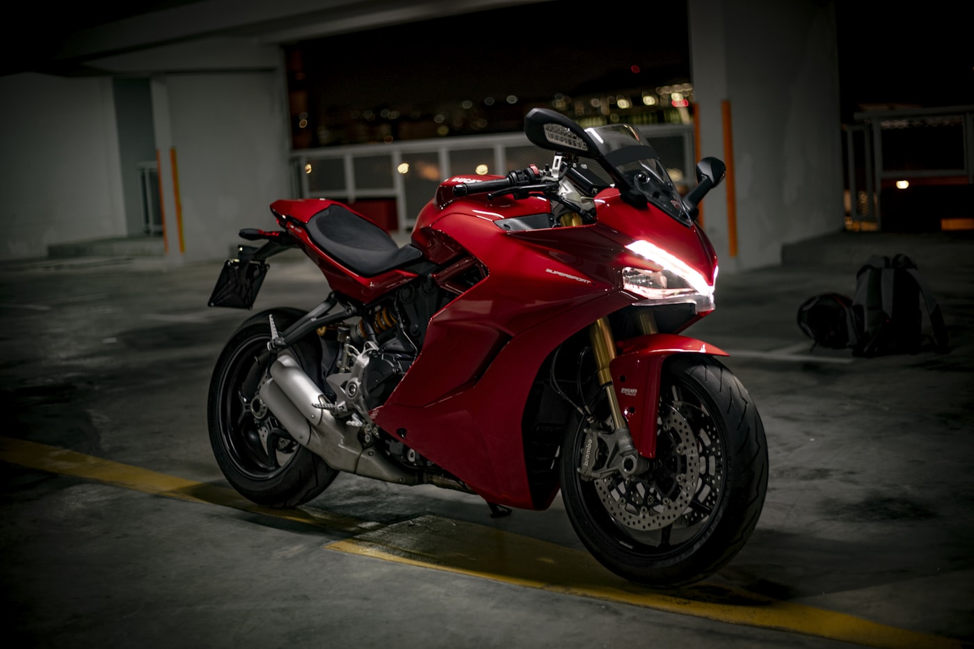 Red sport bike in dark parking garage